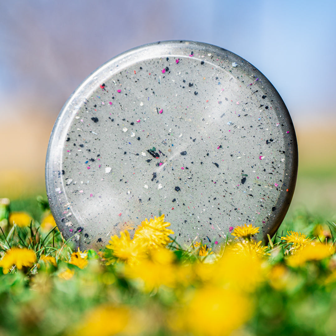 Outdoor shot of the moonstone Crocs Inner Core recycled sustainable disc golf disc